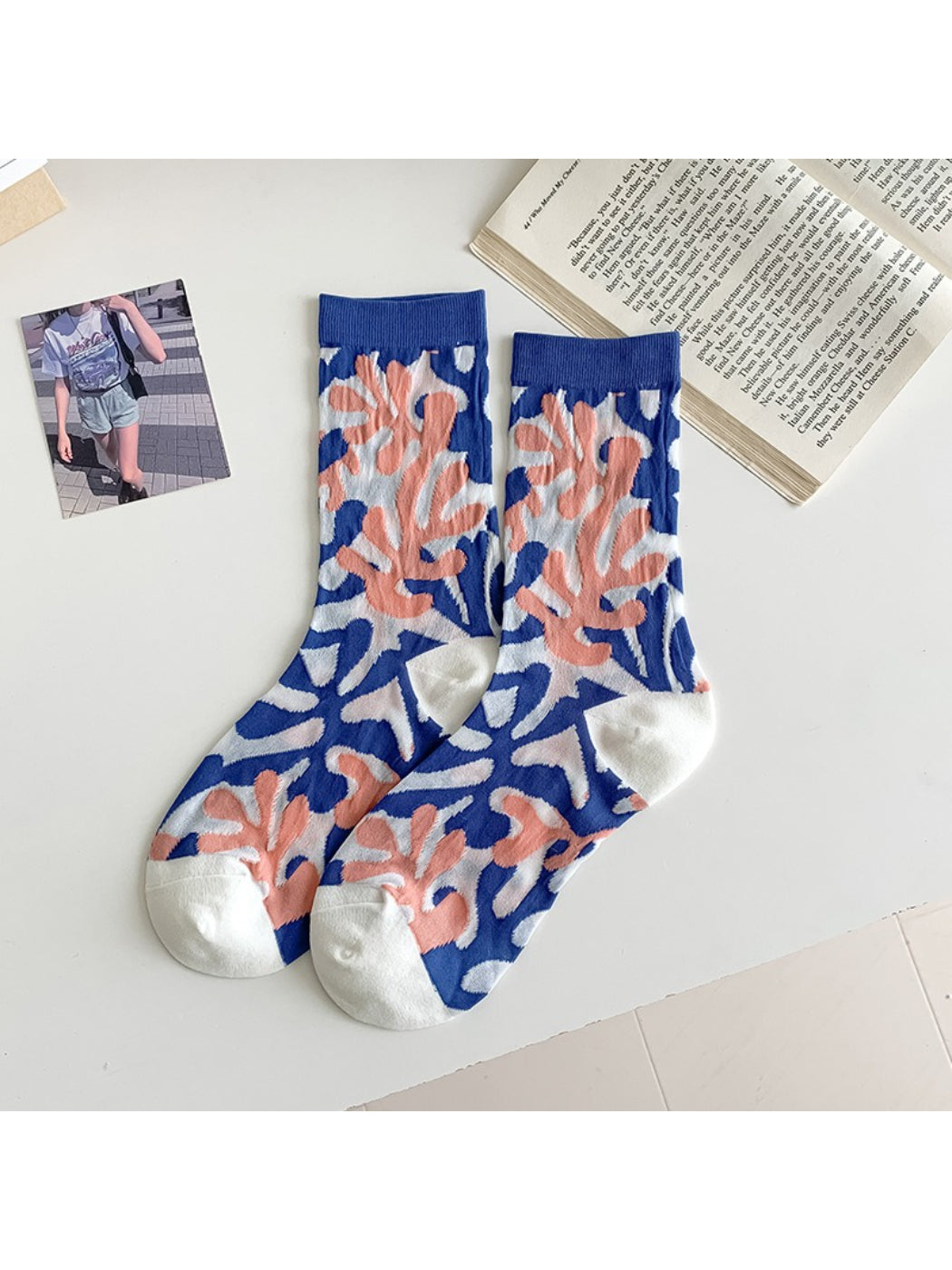 Side view of Rufia modern floral mixed crew socks on model’s feet with visible flower prints