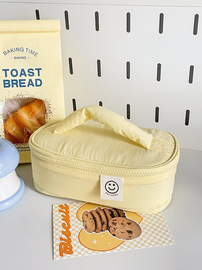 Close-up of Cosbai Smiley Patch Cosmetic Bag with visible smiley patch detail