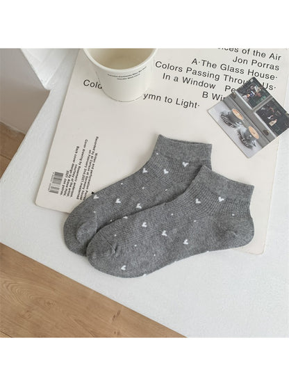 Side view of Rufia ankle sock highlighting heel and heart pattern design