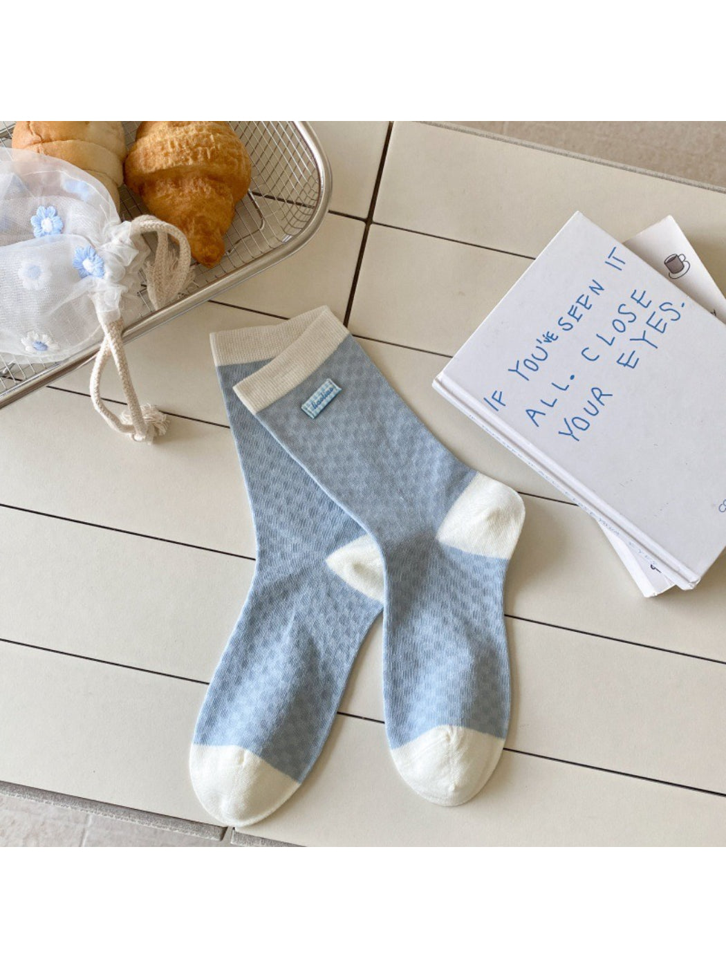 Rufia Sweet Blue Grey crew socks folded neatly with visible color and pattern