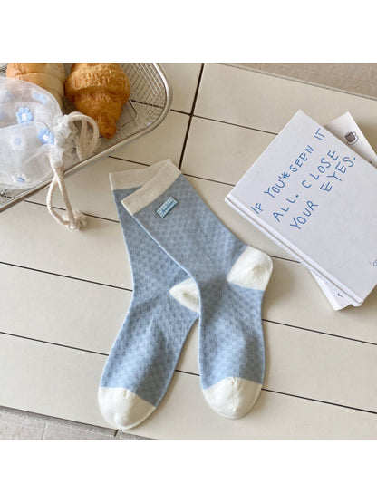 Rufia Sweet Blue Grey crew socks folded neatly with visible color and pattern