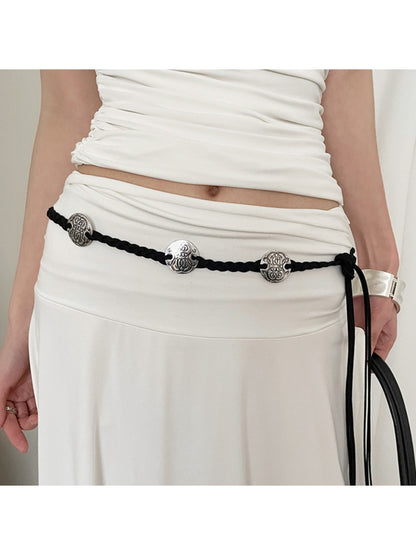 Beco vintage style braided rope belt coiled on white background