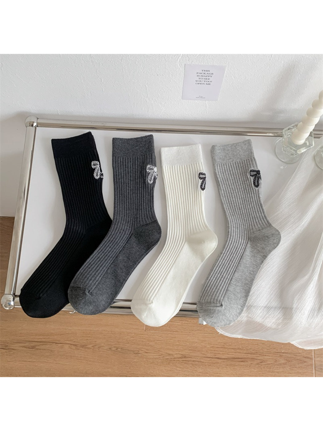 Model wearing Rufia ribbed socks with bow stitch detail and casual shoes