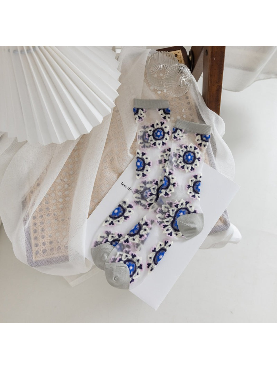 Side view of Rufia sheer blossom pattern crew socks highlighting sheer material