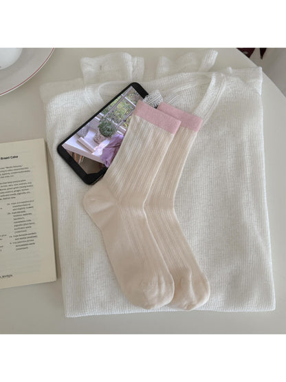 Rufia Dreamy Pastel Bloom crew socks worn on feet showing soft pastel colors and floral print