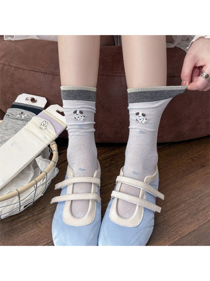 Side view of Rufia mesh low cut socks featuring dog embroidery on white fabric