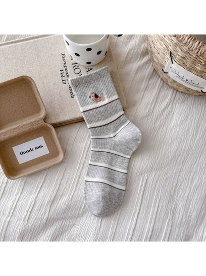 Rufia crew socks with dog embroidery and stripes worn with casual shoes