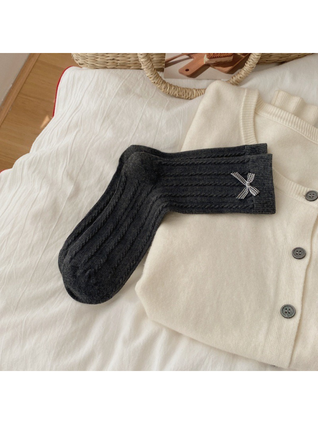 Model wearing Rufia Classic Bow Trim Crew Socks with black shoes and skirt