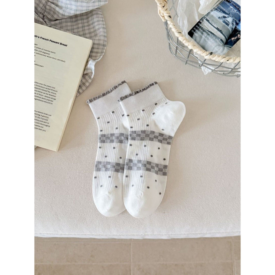 Side view of Rufia ankle sock highlighting ribbon accent and ribbed cuff