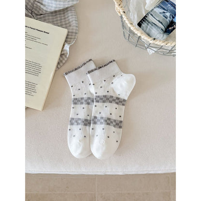 Side view of Rufia ankle sock highlighting ribbon accent and ribbed cuff
