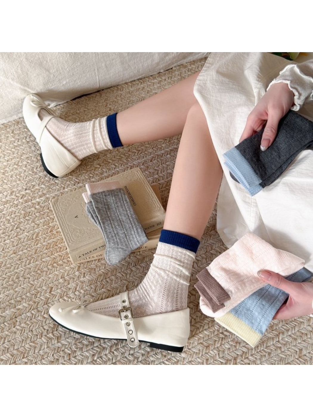 Rufia socks folded to display colourblock pattern with beige, brown, and cream sections