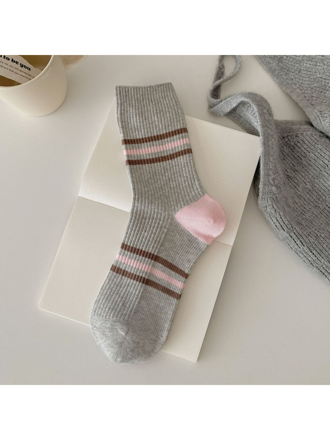 Model wearing Rufia colour block ribbed socks paired with casual footwear