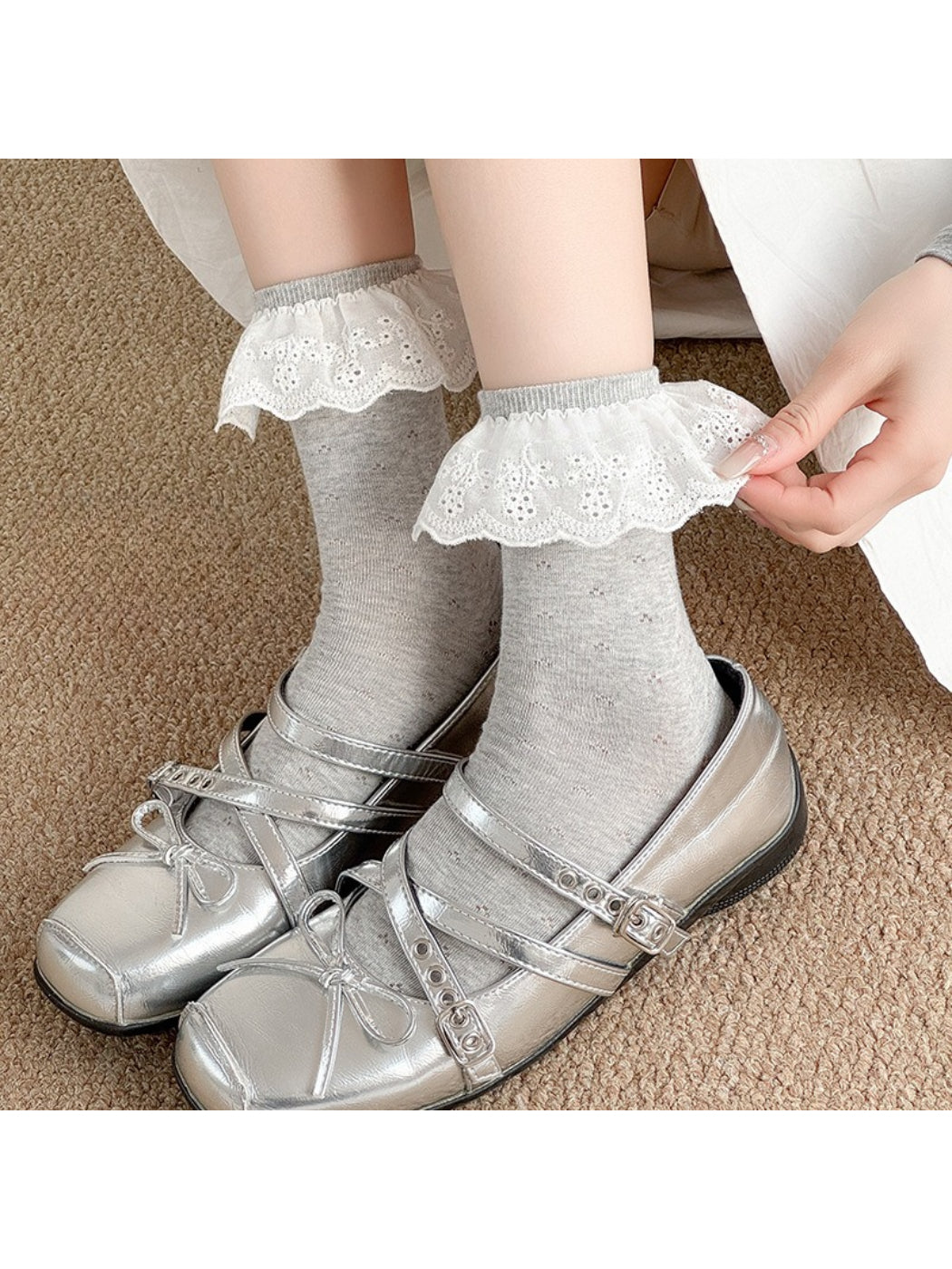 Pair of Rufia lace ruffle trim crew socks in white displayed flat