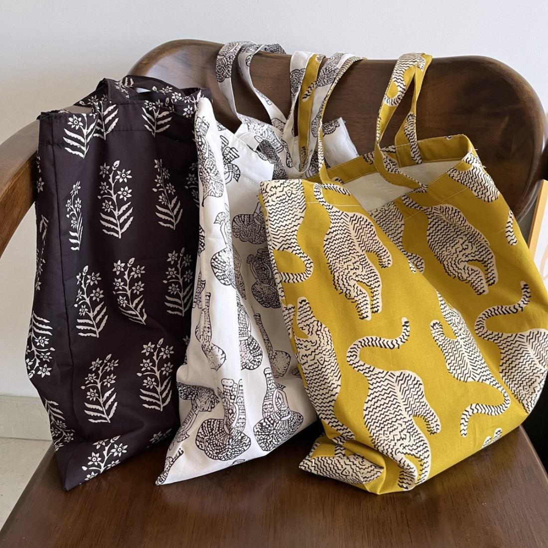 Side view of Cosbai animal and floral print tote bag with handles