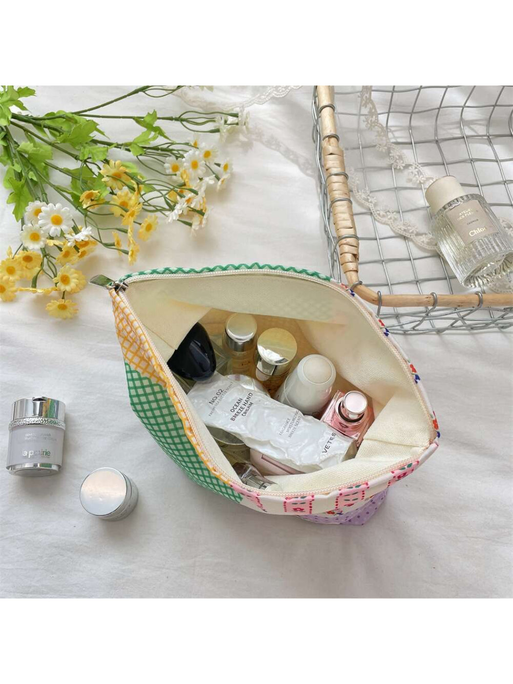 Side view of Cosbai patchwork check cosmetic pouch highlighting shape and texture