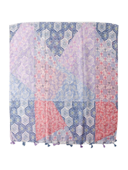 Model wearing pastel patchwork tassel scarf styled with a white top