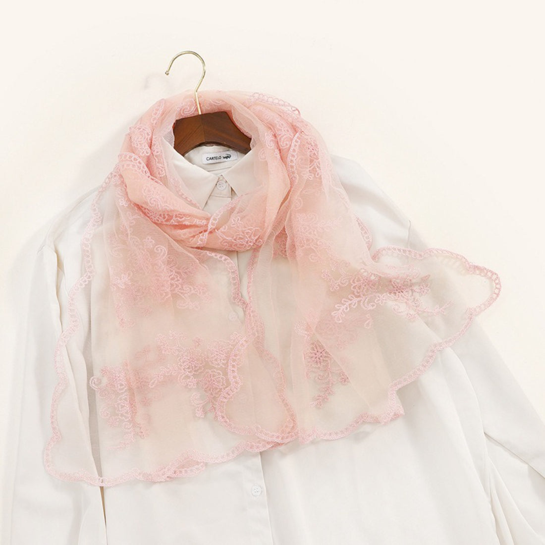 Scarvii scarf folded to highlight embroidered baroque patterns on sheer material