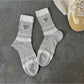 Rufia socks folded to show heart design and soft texture