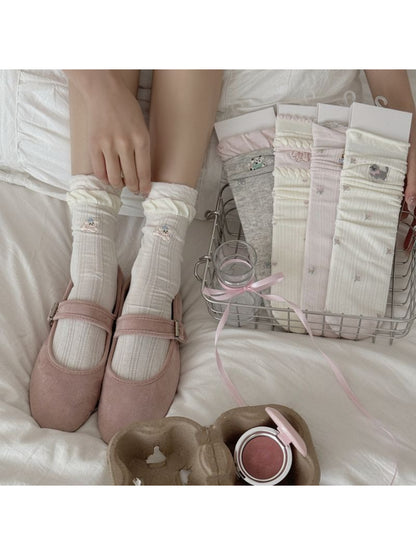 Pair of Rufia Sweet Animal Detail Crew Socks with colorful animal patterns on white background