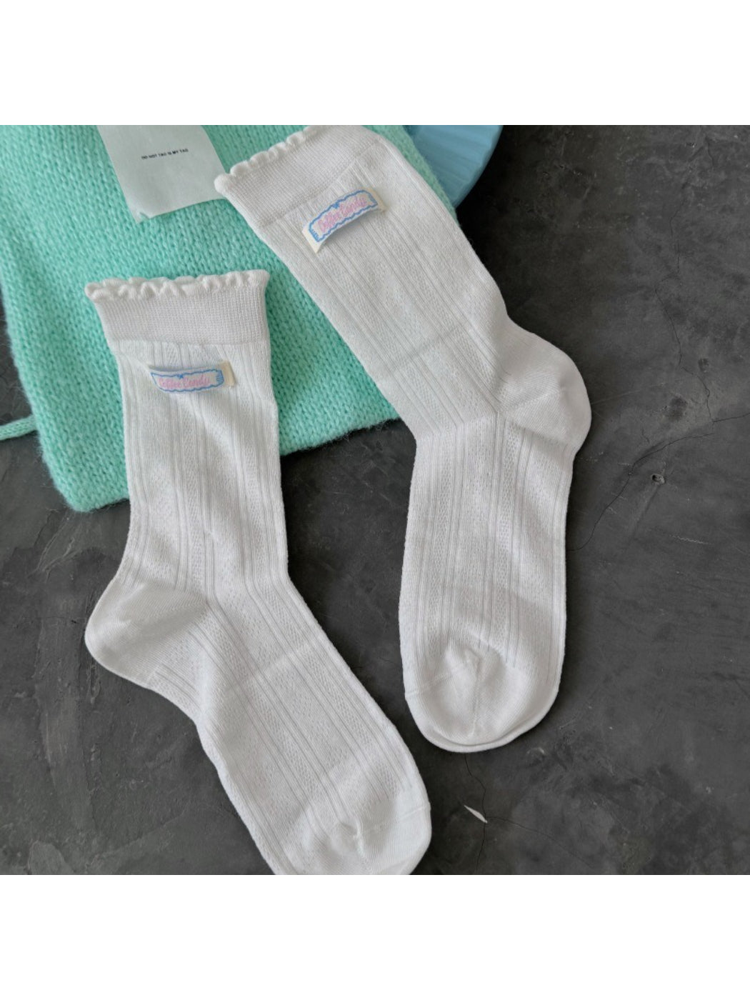 Side view of Rufia scallop trim socks highlighting soft fabric and scalloped edge