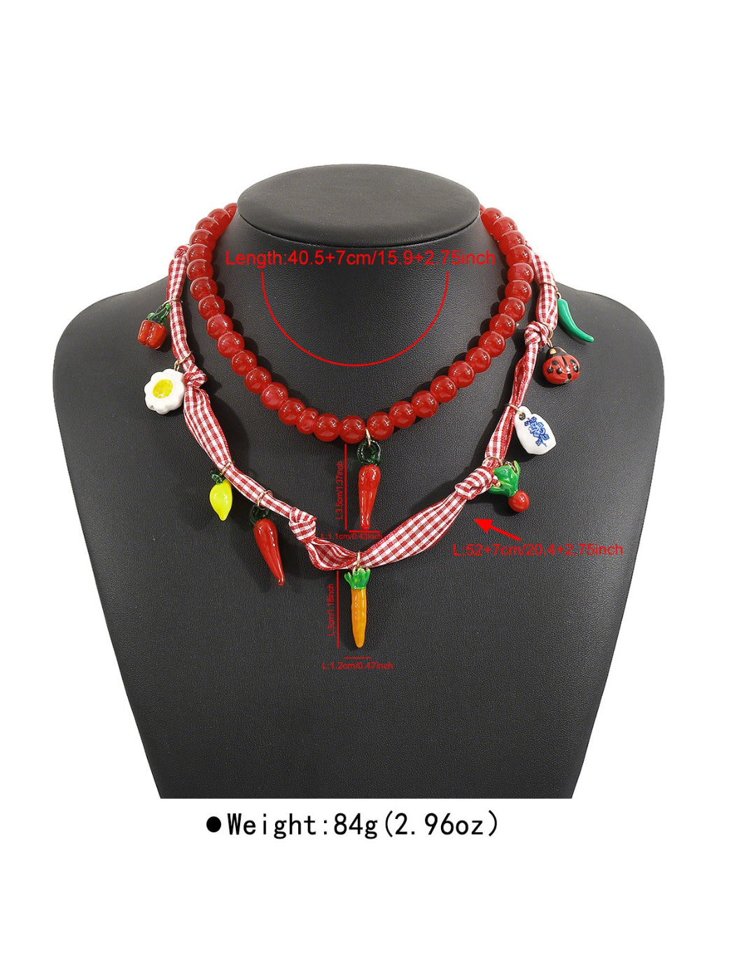Flat lay of the Playful Food Charm Necklace with all food charms arranged neatly
