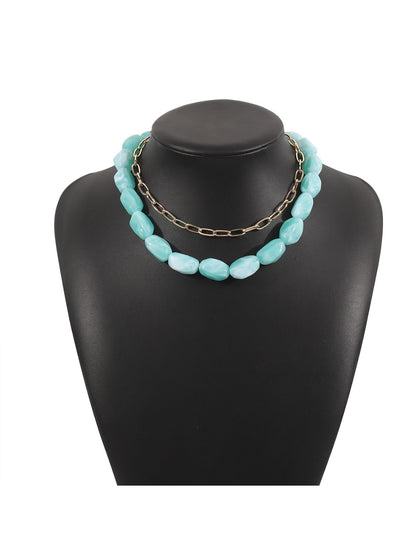 Neckit beaded chain necklace styled with layered jewelry on model
