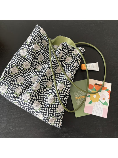 Cosbai Checker Rose Drawstring Bag worn on shoulder demonstrating size and fit