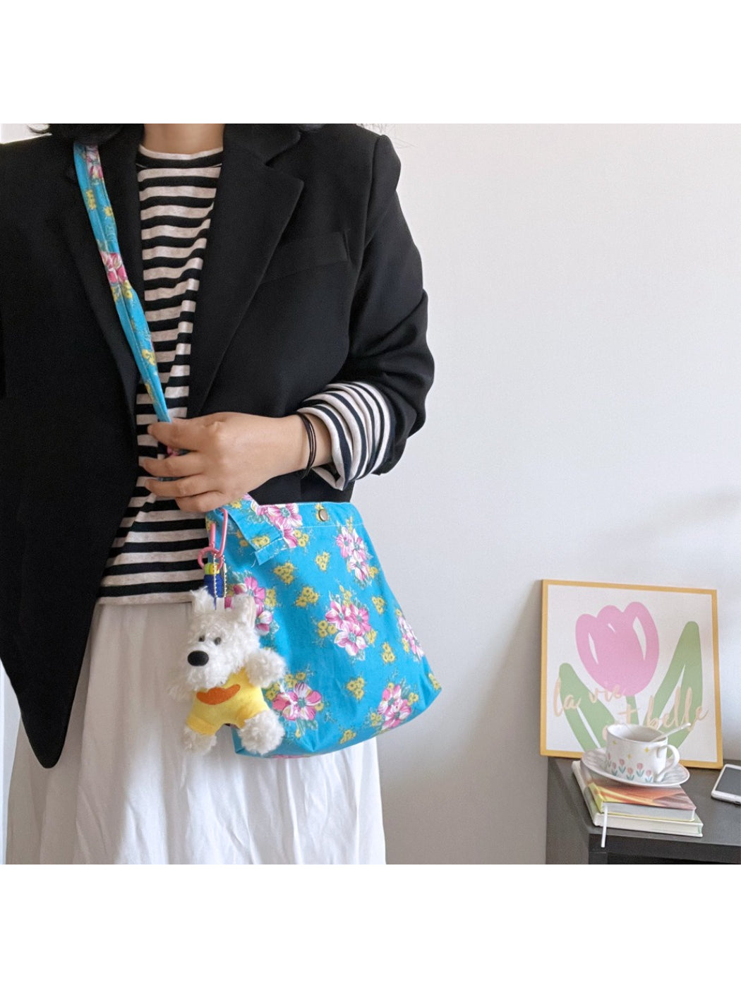 Close-up of floral pattern on Cosbai Painterly Bloom shoulder bag with dog charm
