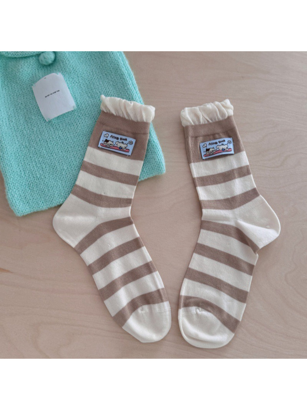 Rufia ribbed socks displayed flat showing full length and patch placement