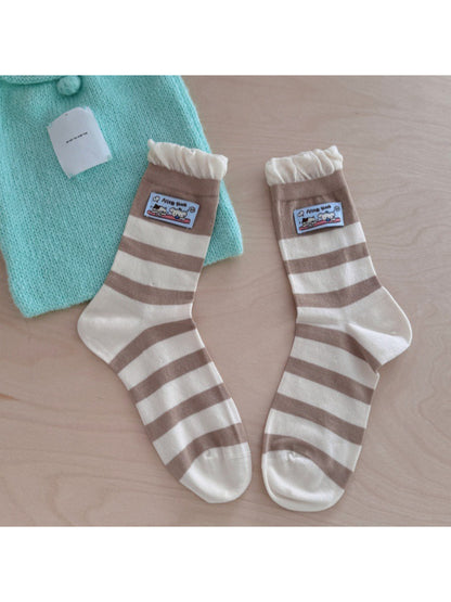 Rufia ribbed socks displayed flat showing full length and patch placement