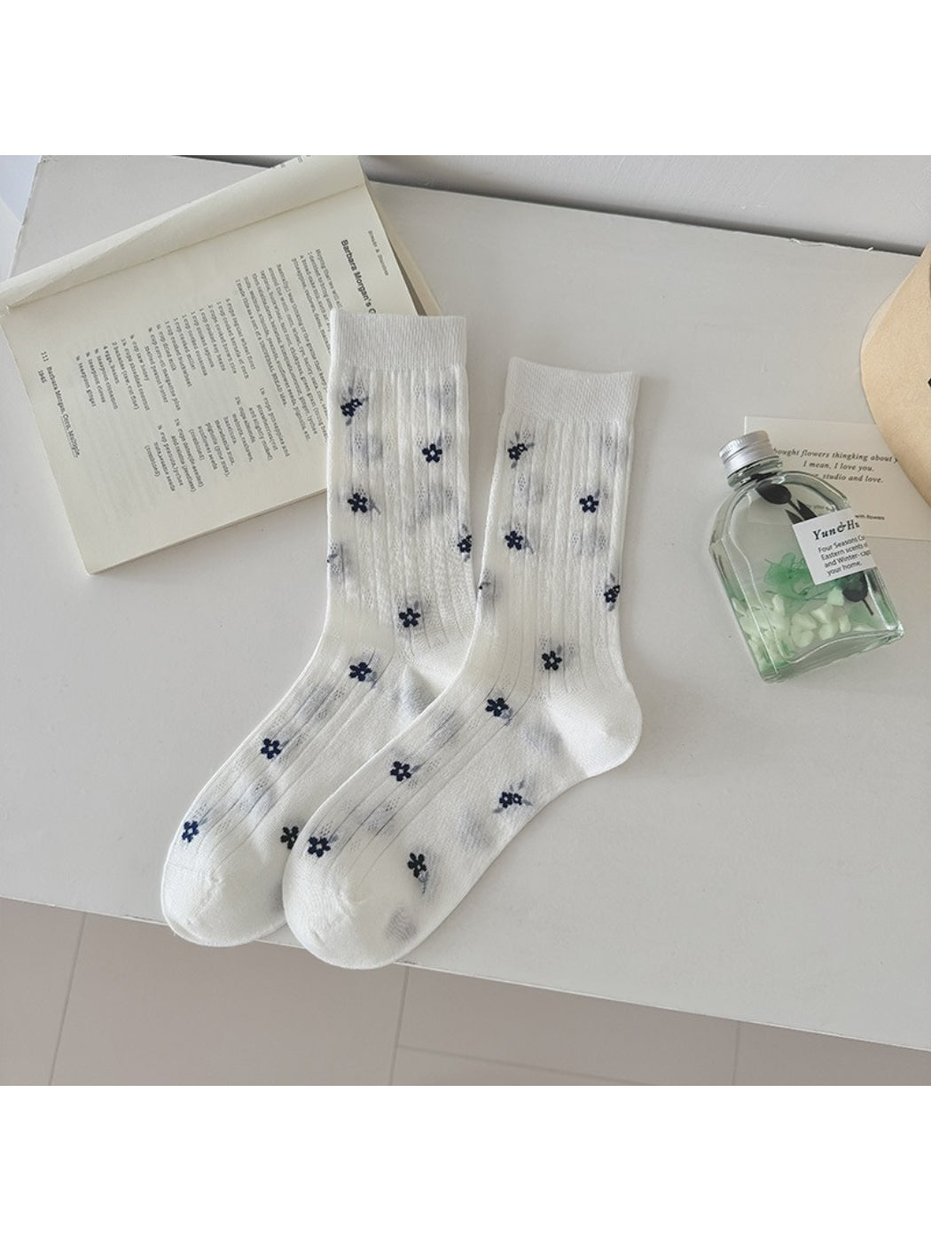 Model wearing Rufia Ditsy Floral Ribbed Crew Socks with casual shoes