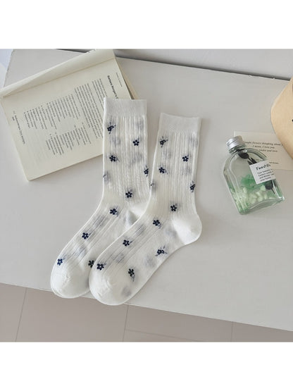 Model wearing Rufia Ditsy Floral Ribbed Crew Socks with casual shoes