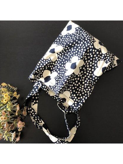 Close-up of floral dot pattern on Cosbai tote bag fabric