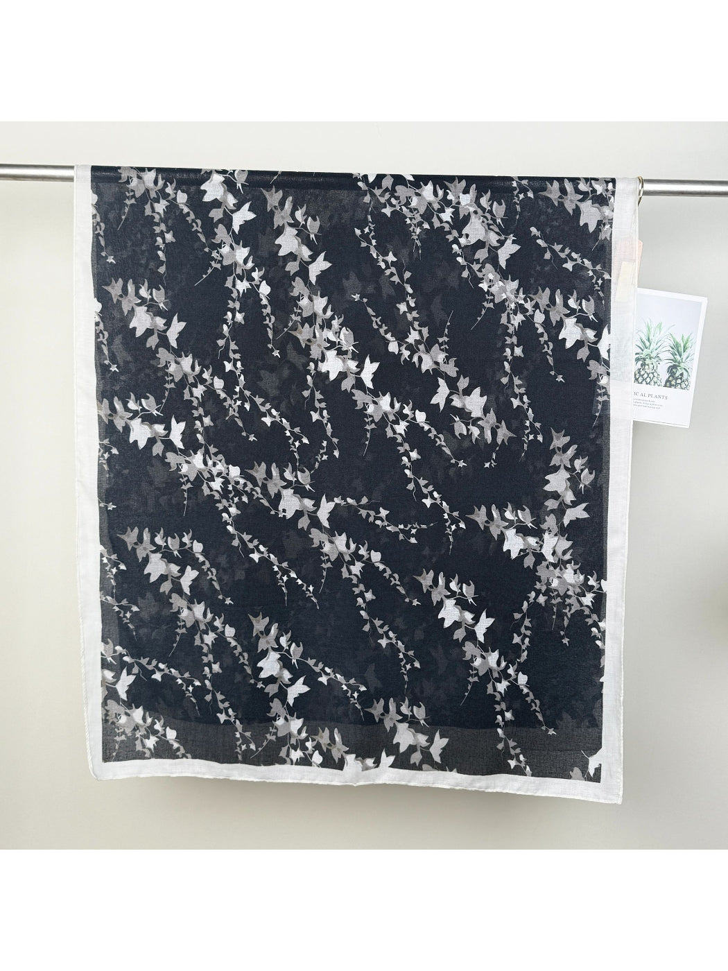 Scarvii leaf print wrap scarf styled as a head wrap on model