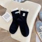 Rufia - Asymmetrical Button Detail Crew Socks