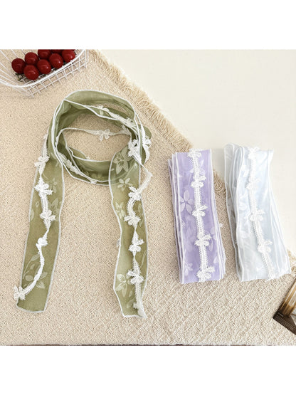 Sheer floral lace trim skinny scarf in soft pastel colors displayed flat