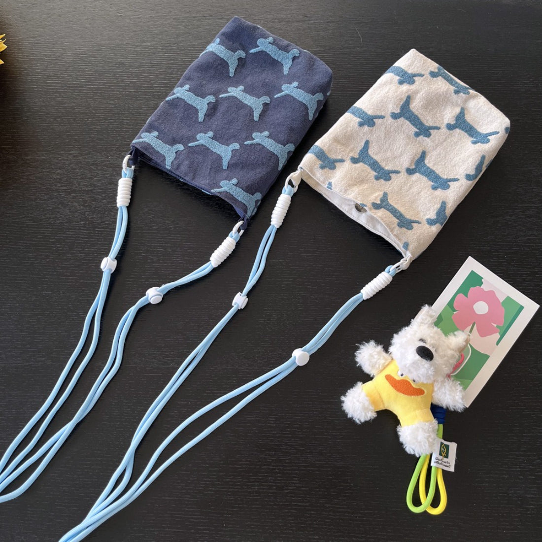 Mini crossbody bag with dog print and compact soft shape