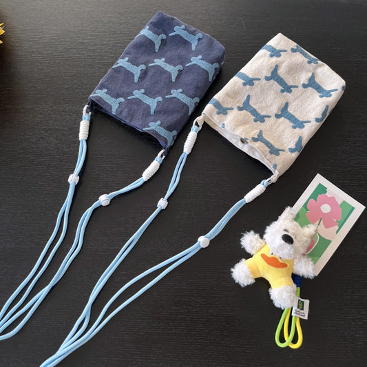 Mini crossbody bag with dog print and compact soft shape