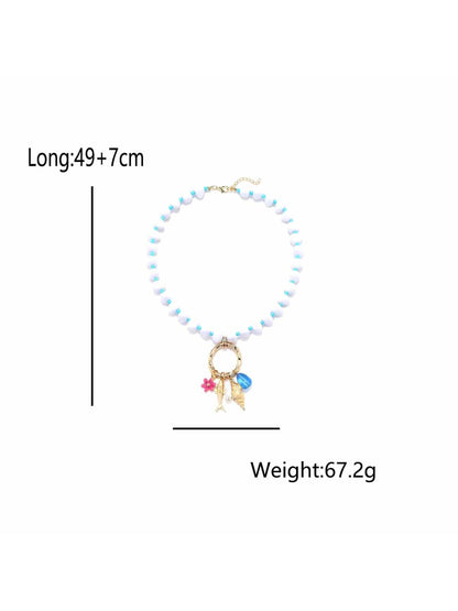 Neckit beaded necklace with ring charm arranged in a circular shape on a light surface