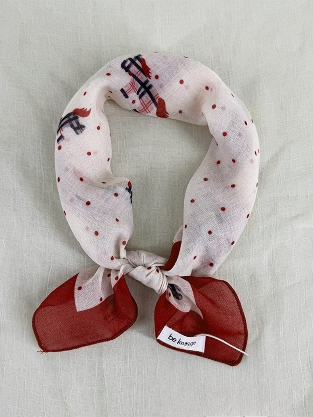 Scarvii Sheer Pony Dot Square Scarf folded showing black and white polka dot pattern