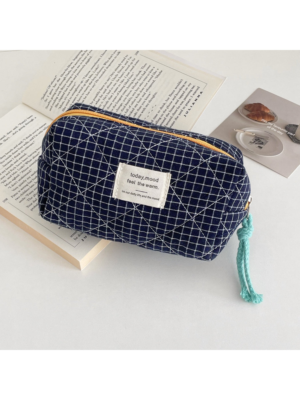 Close-up of Cosbai cosmetic pouch showing quilted grid pattern and vibrant colors