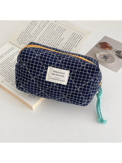 Close-up of Cosbai cosmetic pouch showing quilted grid pattern and vibrant colors