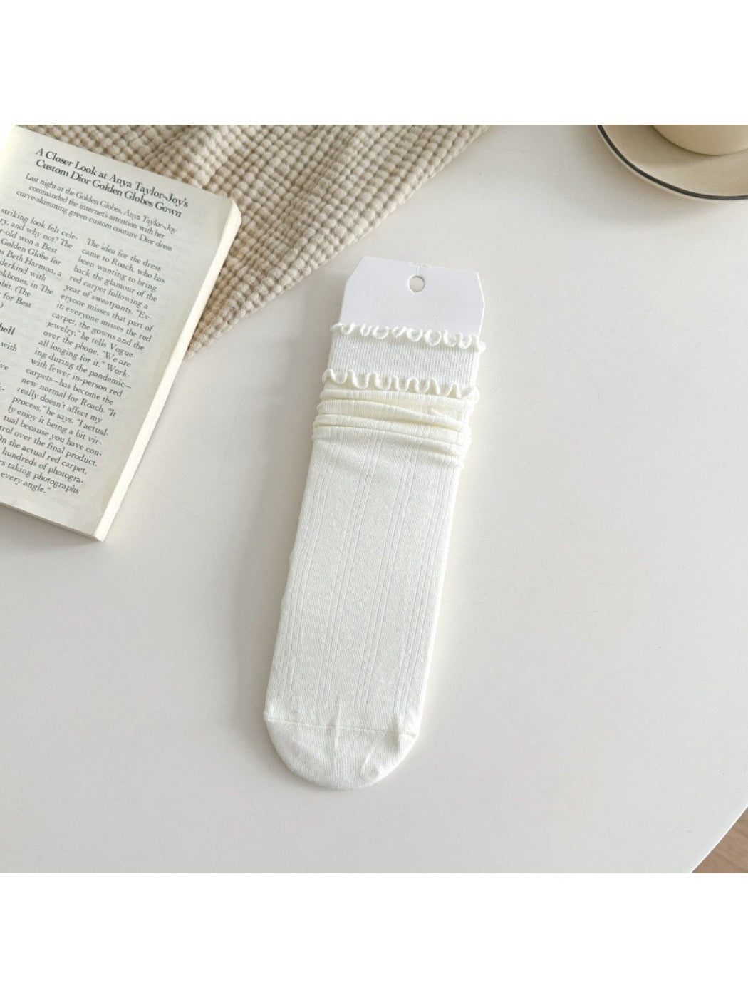 Rufia ruffle mid-calf socks worn on feet with visible ruffle detail