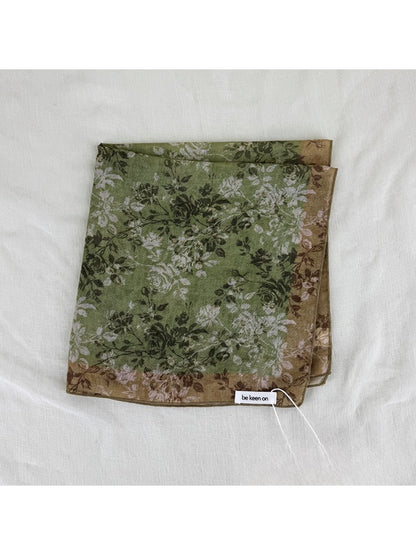 Scarvii vintage floral border scarf styled around a mannequin neck