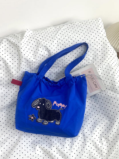 Cosbai Cute Puppy Slouchy Shoulder Bag worn on shoulder by model
