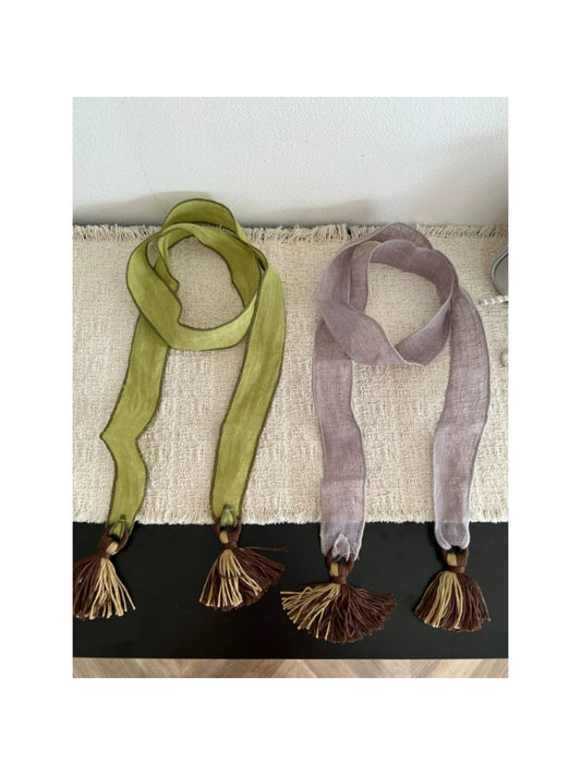 Scarvii boho skinny scarf with tassel trim in neutral tones laid flat