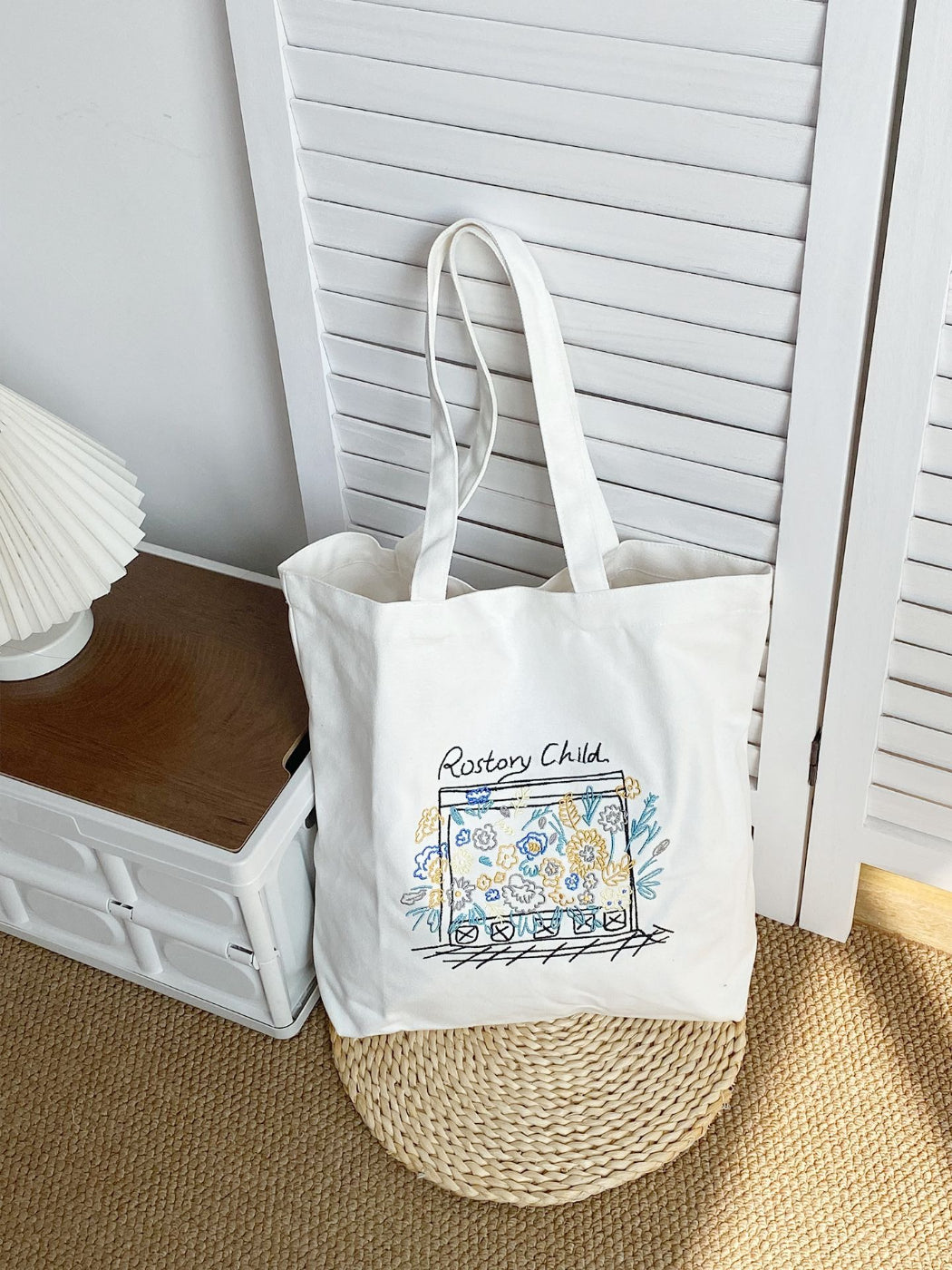 Side view of Cosbai floral illustration tote bag with detailed flowers