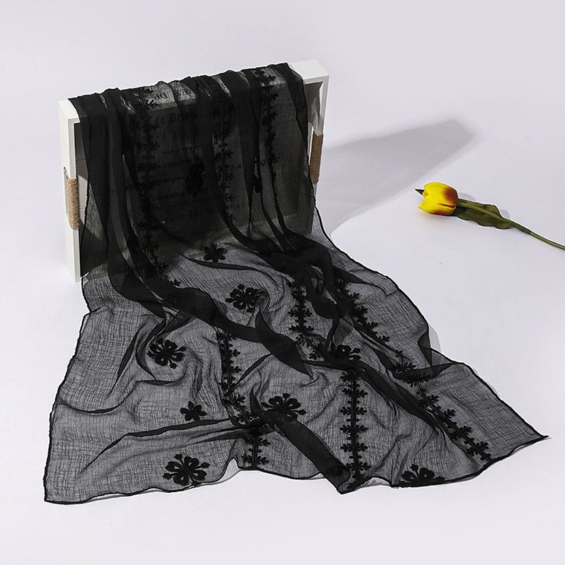 Lightweight Scarvii scarf with delicate blossom stitch pattern in soft pastel colors