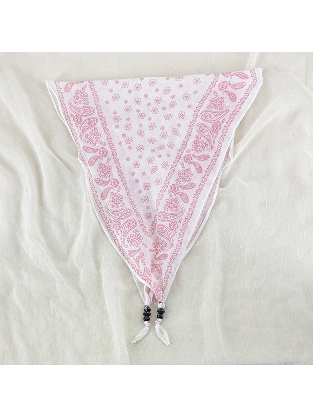 Scarvii vintage bandana headscarf folded with bead trim visible on edges