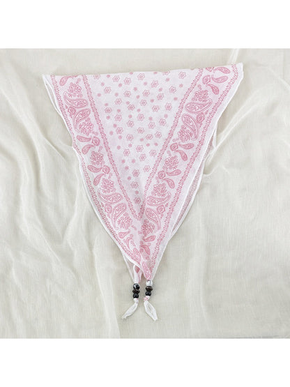 Scarvii vintage bandana headscarf folded with bead trim visible on edges